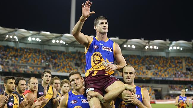 Brisbane champion Jonathan Brown chaired from the Gabba after his 250th. Picture: Getty