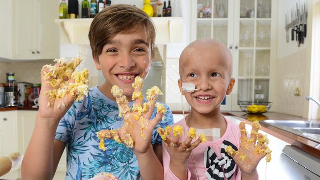 HELPING HAND: Levi and Madison O'Donohue making biscuits in their kitchen.