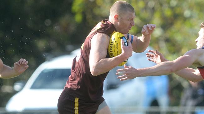 Ben Robertson tries to burst through a tackle. Picture: Chris Eastman/AAP