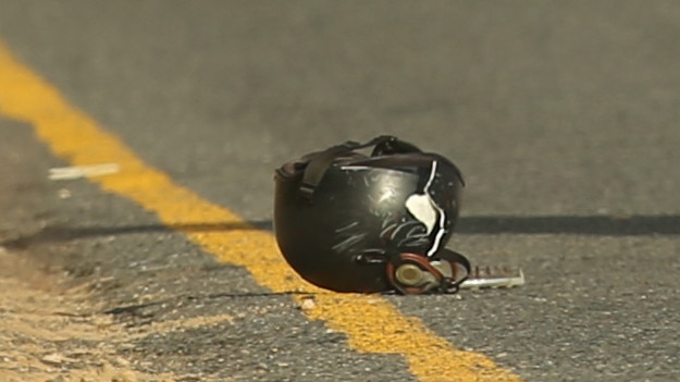 The rider's helmet after he was hit by car at the Blackgate end of 13th Beach Road in Barwon Heads. Picture: Alan Barber