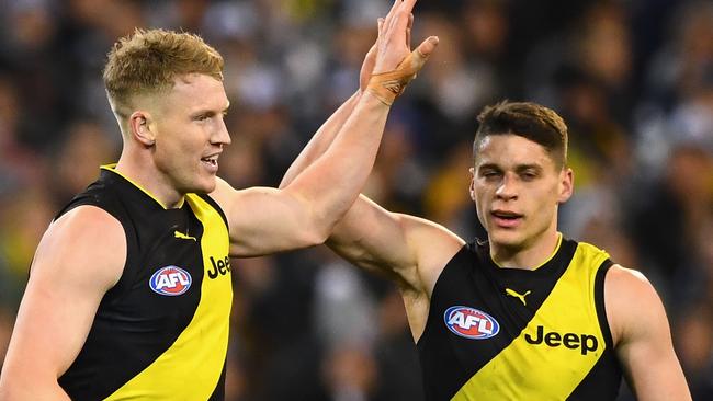 Josh Caddy and Dion Prestia celebrate a goal during the qualifying final win.