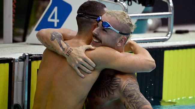 Kyle Chalmers (R) celebrates and Flynn Southam (L) after the men's 100m freestyle swimming final at the 2023 Australian World Championship Trial. (Photo by William WEST / AFP)