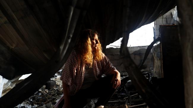 Venessa Downing oin the burnt out remains of her home. Picture: Nikki Short.