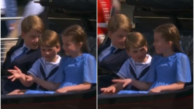 Princess Charlotte was snapped pushing her little brother's hands down as he waved frantically to the crowd. Picture: Twitter / BBC