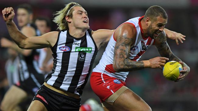 Darcy Moore attempts to spoil Lance Franklin.