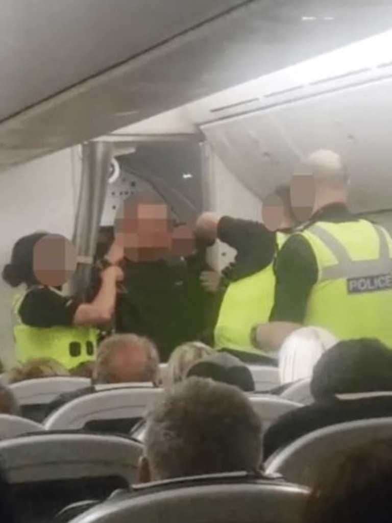 The man was filmed by another passenger after allegedly shouting that the plane was ‘going to crash’. Picture: Supplied