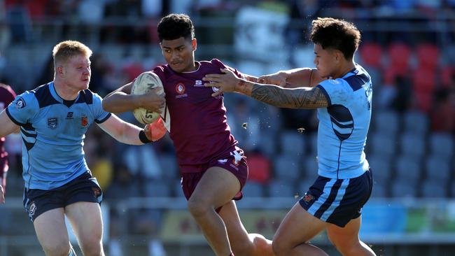 QLD's Karl Oloapu makes a break during the under 18 ASSRL schoolboy rugby league championship grand final between QLD v NSW CHS from Moreton Daily Stadium, Redcliffe. Picture: Zak Simmonds