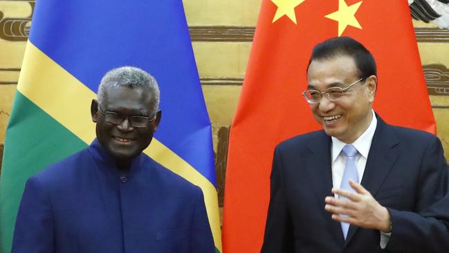 Solomon Islands Prime Minister Manasseh Sogavare and Chinese Premier Li Keqiang attend pictured in 2019. A leaked draft security agreement between the countries has raised alarm in Australia. (Photo by Thomas Peter-Pool/Getty Images)