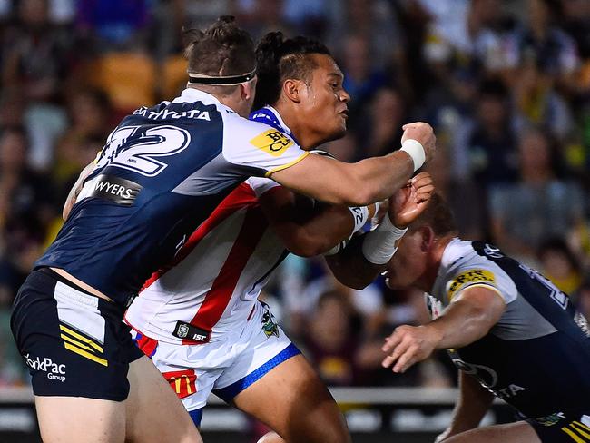 Joseph Leilua of the Knights is tackled by Ethan Lowe.