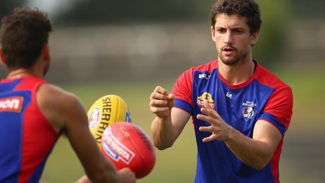 MELBOURNE, AUSTRALIA - MARCH 11: Tom Liberatore of the Bulldogs handballs during a Western Bulldogs AFL training session at Whitten Oval on March 11, 2016 in Melbourne, Australia. (Photo by Robert Cianflone/Getty Images)