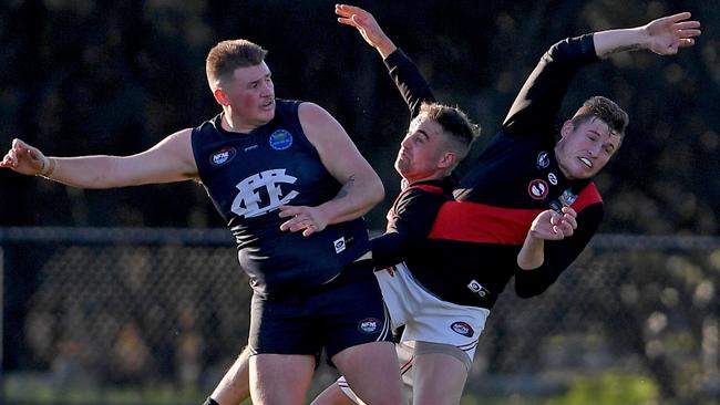 Epping and Eltham players fly for the ball. Picture: Andy Brownbill