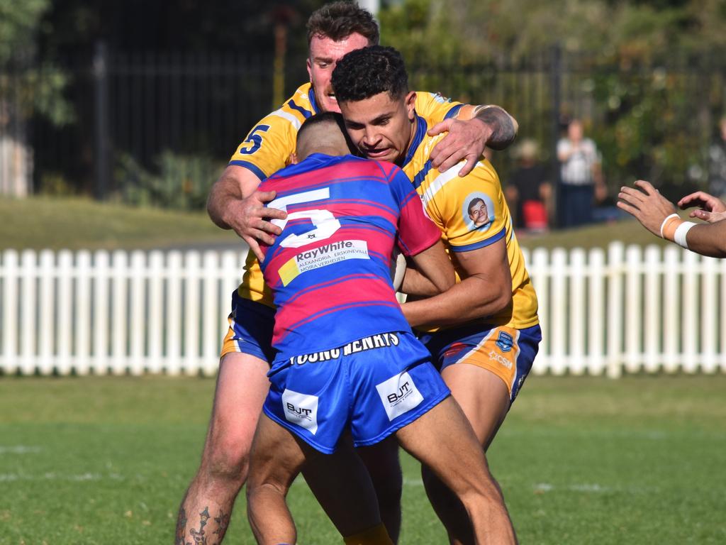 Kieren Mundine is tackled by Kalolo Uele. Picture: Sean Teuma