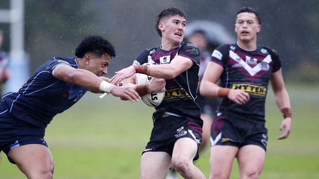 Cody Hamilton of Marsden and Jacob Taulani of Redcliffe in action at Redcliffe during the Langer Trophy schoolboy rugby league between Redcliffe State High School and Marsden State High School, Brisbane 12th of July 2022. (Image/Josh Woning)