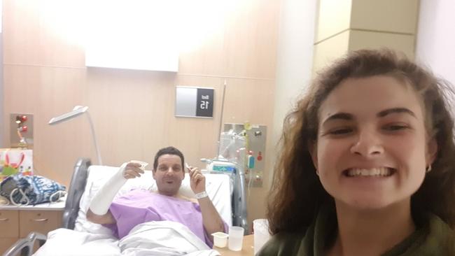 John Ponte, 55, with daughter Leeanne, in hospital. John will undergo surgery on Friday for his serious injuries, which will take three months to heal. Picture: Leeanne Ponte.