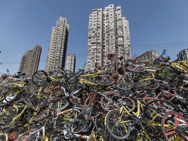 Ride-sharing bicycles from all major companies sit in a pile. Photographer: Qilai Shen/Bloomberg via Getty Images