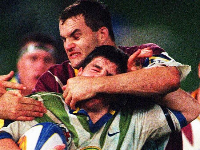 Luke Priddis is grabbed around head by Peter Ryan during Super League (SL) game between Canberra Raiders & Brisbane Broncos at Bruce Stadium 14/07/97Rugby League A/CT