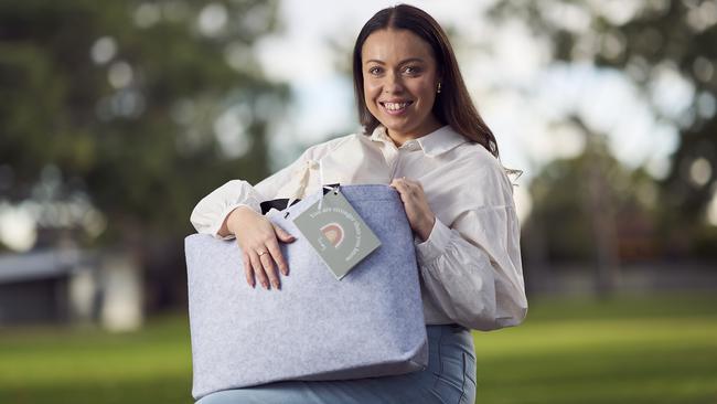 Founder, Stephanie Malan in Clarence Park, with a care bag from The Village Co. for vulnerable mums, Thursday, May 23, 2024. Picture: Matt Loxton