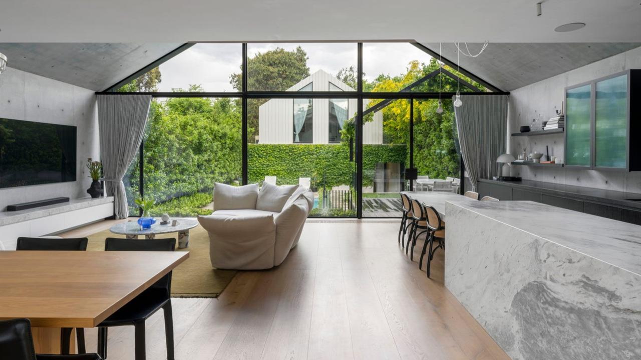 The living room and kitchen opens out to huge feature windows which ‘make you feel like you’re outside’.