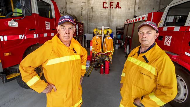 Retired CFA captain Frank Whelan and former CFA captain Warren Davis at Lilydale fire station in Victoria, where they have both been reinstated as volunteers. Picture: David Geraghty