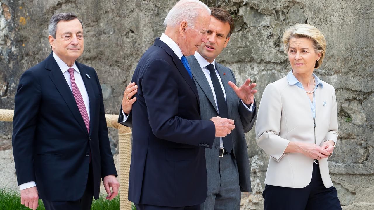 The man on the left is Italian Prime Minister Mario Draghi, and he is currently feeling rather left out. Meanwhile French President Emmanuel Macron has the air of a man explaining how televisions work to his grandfather. Picture: Jonny Weeks/Getty Images