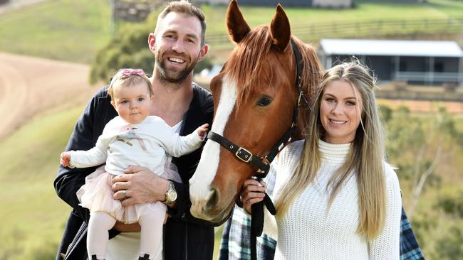 Travis and Rebeccah with their daughter, Scarlett on their Kangaroo Ground property. Picture: Jay Town