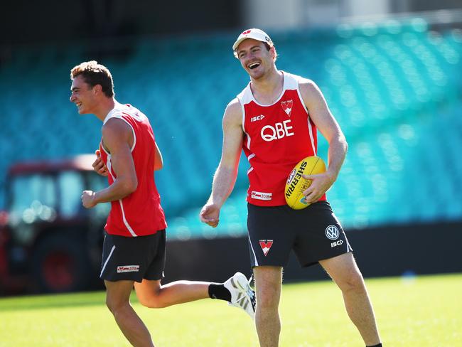 Gary Rohan shares a laugh with teammate Will Hayward (L) during the Sydney Swans training.