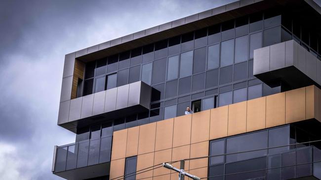 A seven-storey apartment block on the corner of Burnley and Palmer streets is in lockdown. Picture: Nicole Cleary