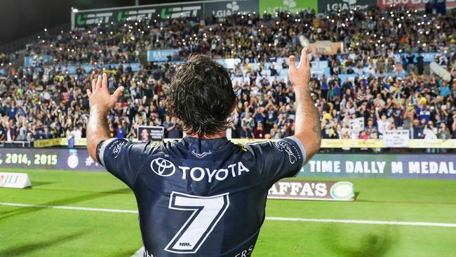 Johnathan Thurston waves to Cowboys fans after playing his last home game. Picture: AAP