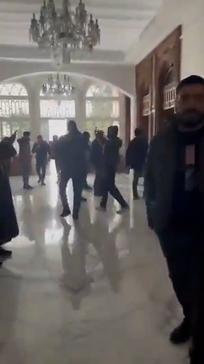 Syrians storm the presidential palace in Damascus