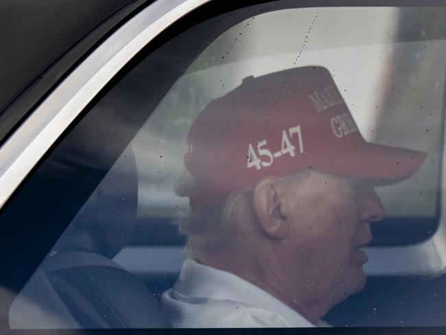 US President Donald Trump is seen in his motorcade driving through West Palm Beach as the feud erupted. Picture: AP