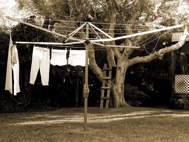 Hills Hoist clothesline in backyard of suburban house.New South Wales (NSW) / Housing