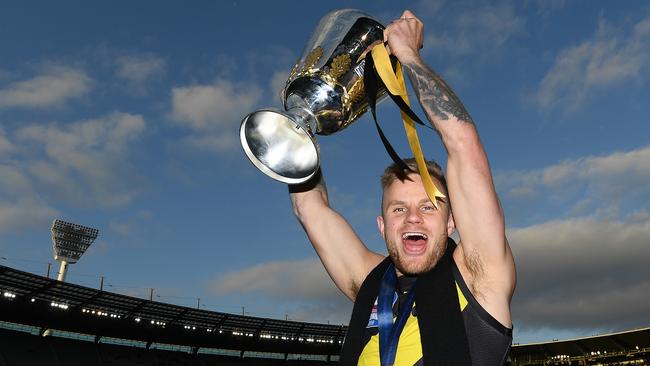 MELBOURNE, AUSTRALIA - SEPTEMBER 28: Brandon Ellis of the Tigers celebrates with the Premiership Trophy during the 2019 AFL Grand Final match between the Richmond Tigers and the Greater Western Sydney Giants at Melbourne Cricket Ground on September 28, 2019 in Melbourne, Australia. (Photo by Quinn Rooney/Getty Images)