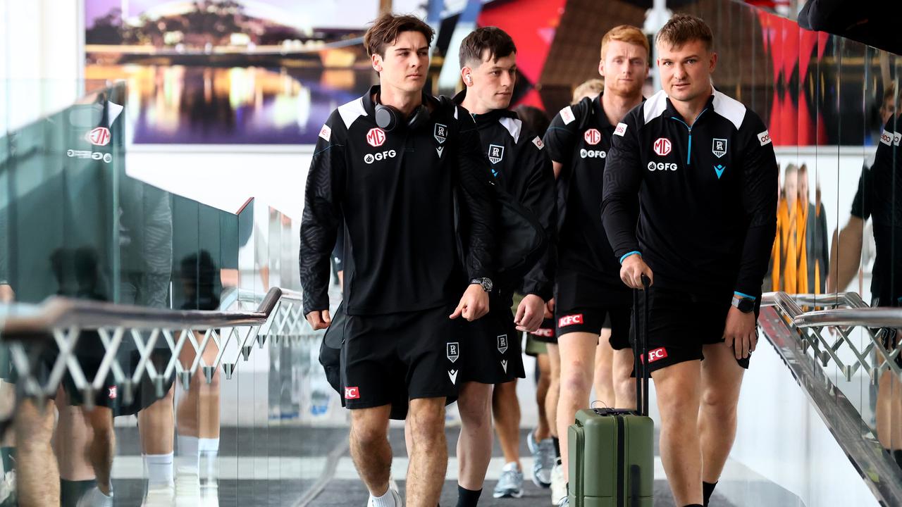 Connor Rozee, Zak Butters, Will Drew and Ollie Wines arrive back in Adelaide after the losing their preliminary final to the Sydney Swans. Picture: Kelly Barnes