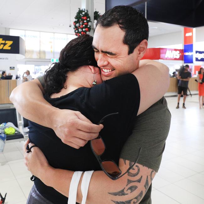 Yonni Paul bursts into tears as he reunites with his wife Carlina Paul. Picture: Scott Powick