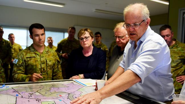 Prime Minister of Australia Scott Morrison visits Lavarack Barracks, discussing plans of affected areas. Picture: Alix Sweeney