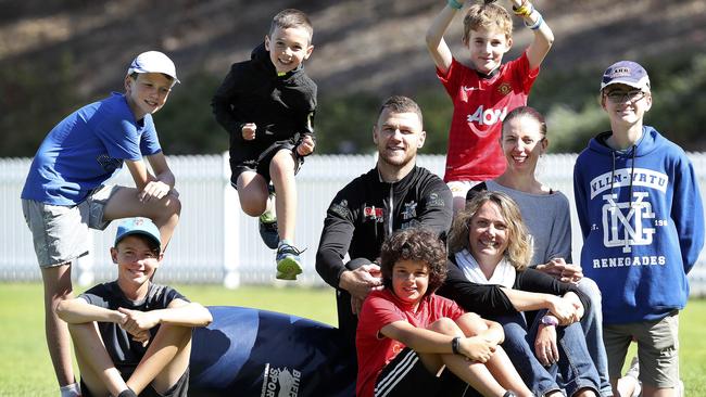 Port Adelaide’s Robbie Gray with defence force children and their mothers - (L-R) Harrison Weekley, Joshua Weekley, Cooper Weekley, Robbie Gray, Aidan Grasso Zack Watson, Monique Weekley, Cheryl Watson and Jaxon Watson. Picture: Sarah Reed