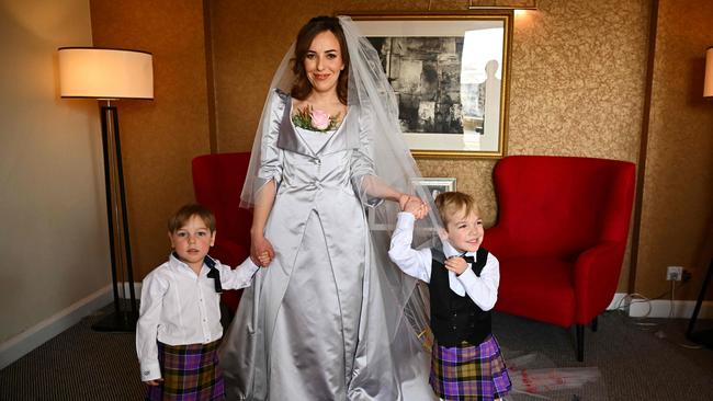 Stella Assange in her wedding dress with her two boys, Gabriel, 5, and Max, 4. Picture: AFP