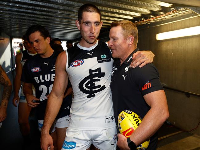 ADELAIDE, AUSTRALIA - APRIL 06: Jacob Weitering of the Blues and Michael Voss, Senior Coach of the Blues celebrate during the 2024 AFL Round 04 match between the Fremantle Dockers and the Carlton Blues at Adelaide Oval on April 06, 2024 in Adelaide, Australia. (Photo by Michael Willson/AFL Photos via Getty Images)