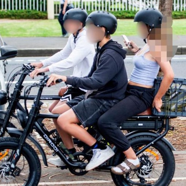 A young e-bike rider, wearing “jorts” at Manly. Picture: Supplied