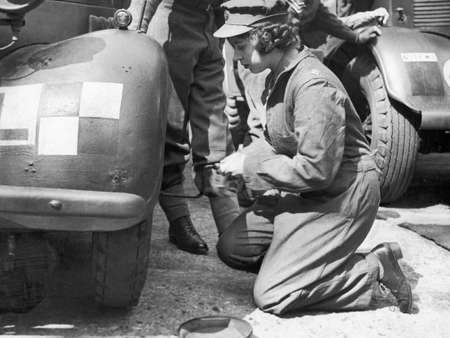 Princess Elizabeth learning basic car maintenance as a Second Subaltern in the A.T.S in 1945. Picture: Daily Mirror/Mirrorpix/Mirrorpix via Getty Images