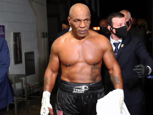 TOPSHOT - LOS ANGELES, CALIFORNIA - NOVEMBER 28: Mike Tyson exits the ring after receiving a split draw against Roy Jones Jr. during Mike Tyson vs Roy Jones Jr. presented by Triller at Staples Center on November 28, 2020 in Los Angeles, California.   Joe Scarnici/Getty Images for Triller/AFP (Photo by Joe Scarnici / GETTY IMAGES NORTH AMERICA / AFP)