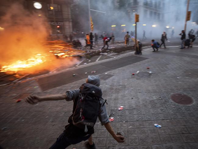 Demonstrators clash with police in Barcelona, Spain. Picture: AP Photo/Emilio Morenatti