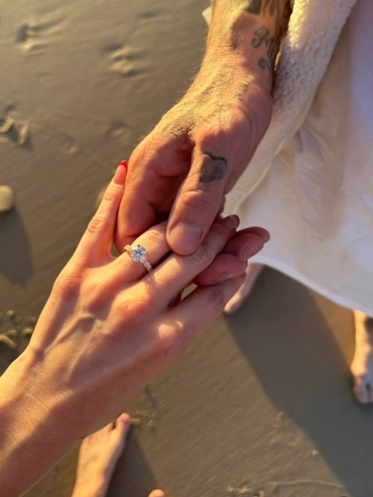 Todd carney and Susie Bradley show off her ring for the camera. Photo: Instagram @todd_carneyofficial.