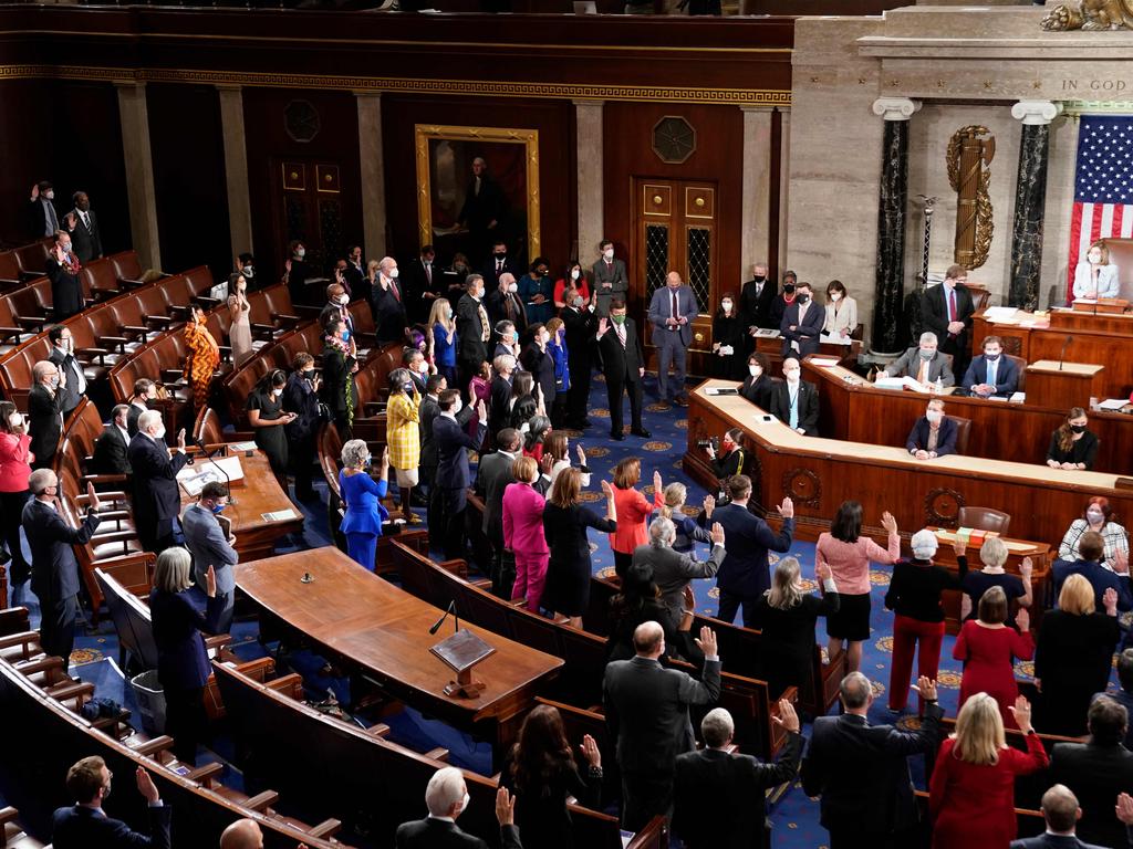 Democratic members of the US House of Representatives take their oath of office administered by Speaker of the House Nancy Pelosi on the floor of the House Chamber. Picture: AFP