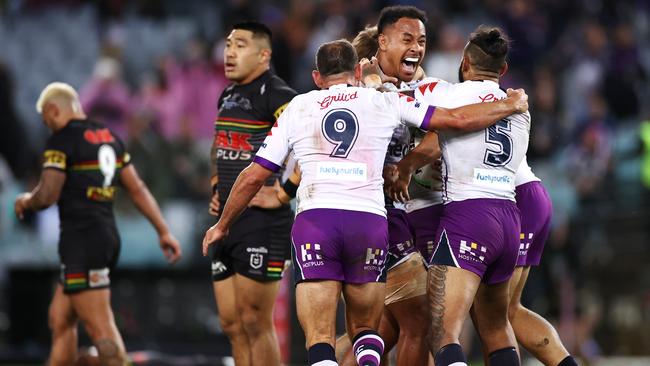 Felise Kaufusi of the Storm celebrates with Josh Addo-Carr and Cameron Smith after the final siren, winning the 2020 NRL Grand Final. Picture: Getty Images