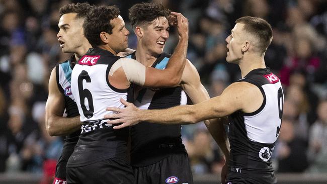 Connor Rozee celebrates a goal with his teammates in the opening quarter. Picture: Getty Images