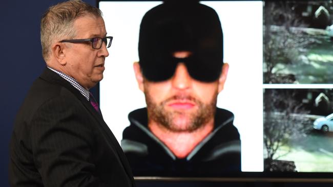 Homicide detective Mick Hughes and a photofit of a man they wished to speak to and the owner of a car seen in the area of the murder. Picture: Nicole Garmston