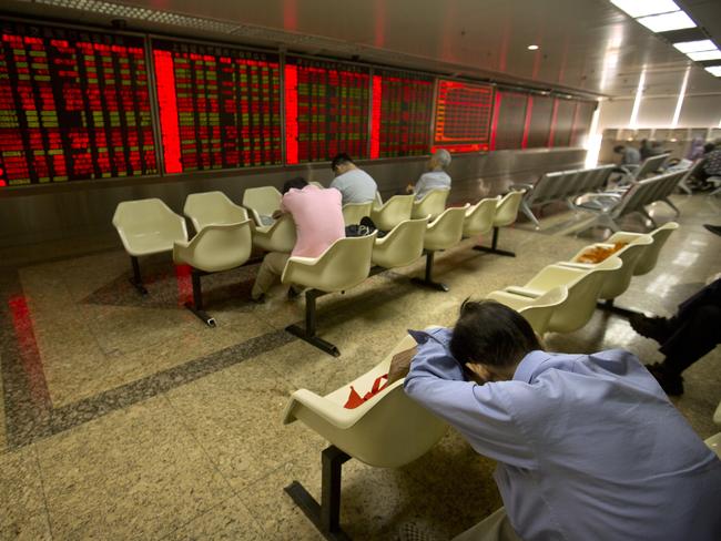 A Chinese investor takes a nap in a brokerage house in Beijing.