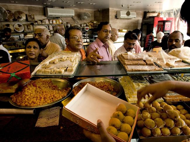 People buy sweets ahead of Dilwali celebrations in New Delhi. Picture: AP