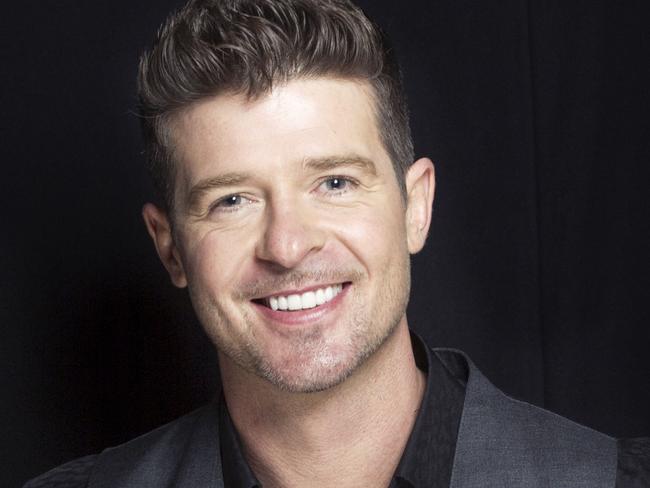 FILE - This Aug. 1, 2013 file photo shows R&B singer-songwriter Robin Thicke in New York. The crooner’s new album, “Paula,” only sold 24,000 units in its debut week in the United States. It’s a far cry from his “Blurred Lines” album, which sold 177,000 units when it debuted last July. (Photo by Victoria Will/Invision/AP, File)